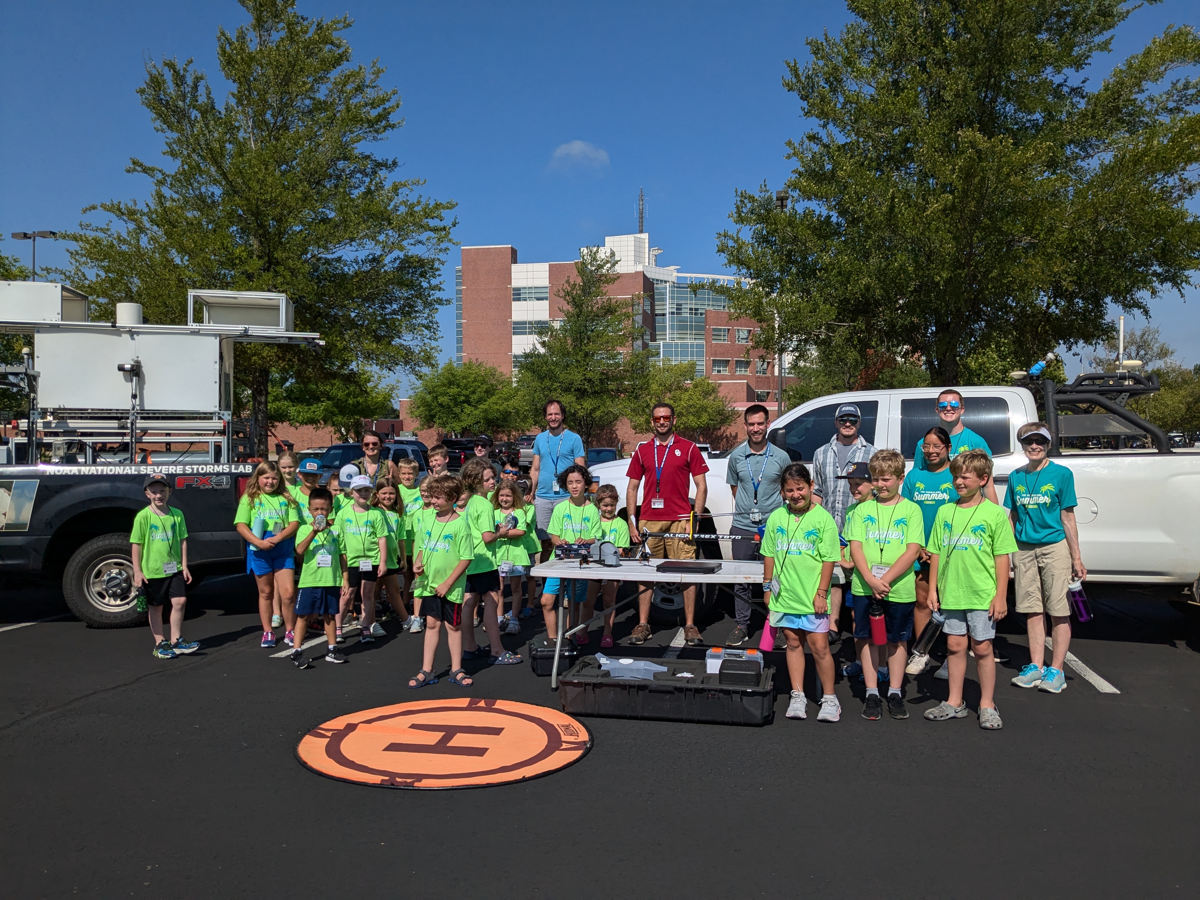 The group of campers stuck out the heat to experience many OU/NSSL research equipment platforms.